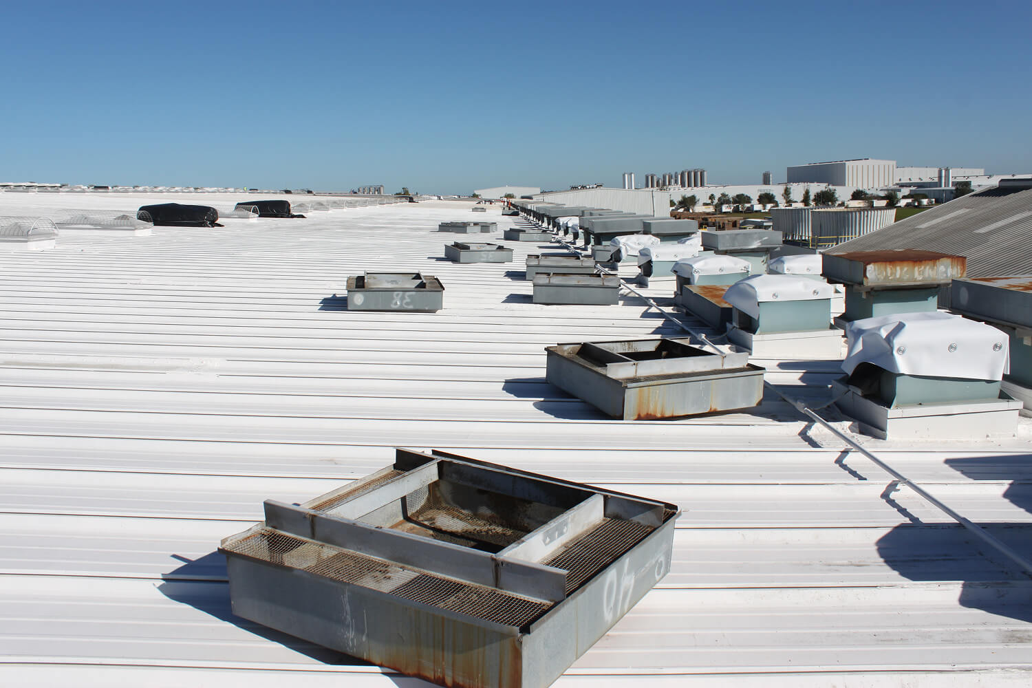 Large Miami commercial roof ready for inspection and service planning